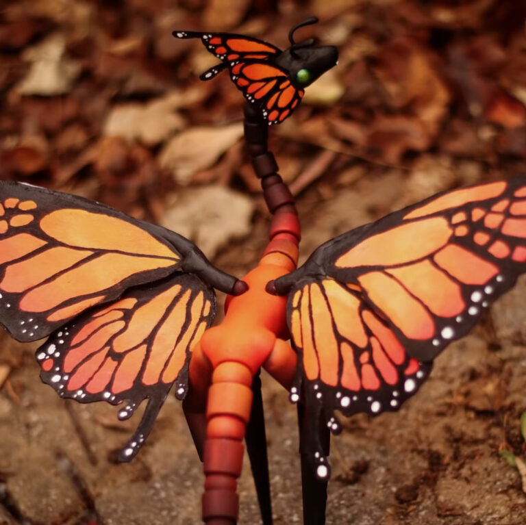 Orange butterfly dragon ball jointed dragon doll in autumn setting