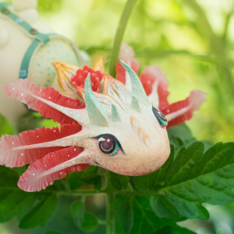 Happy axolotl BJD dragon closeup in a nature setting