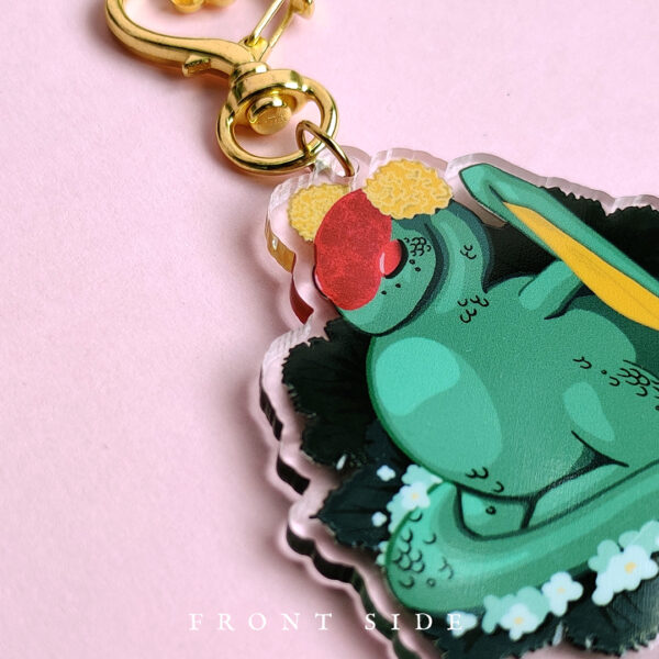 Close up of a green dragon acrylic charm