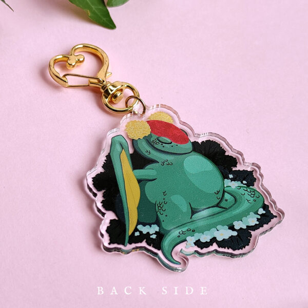 Side view of a green dragon acrylic charm