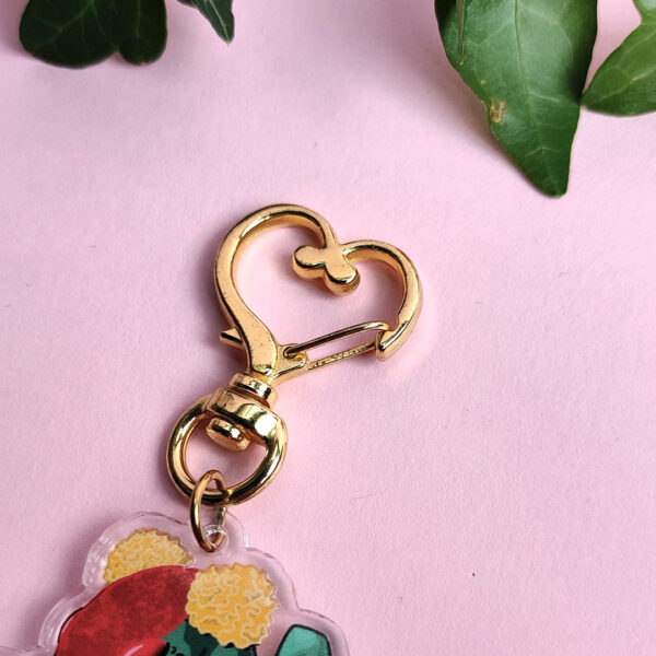 Close up of the metal clasp that holds the dragon charm